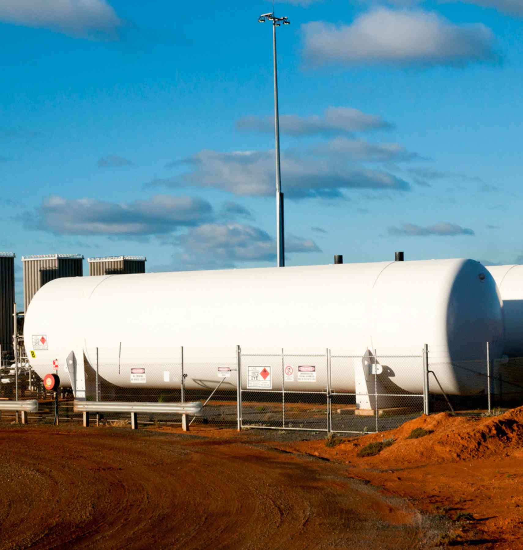 Large above ground tankers at a mining site.