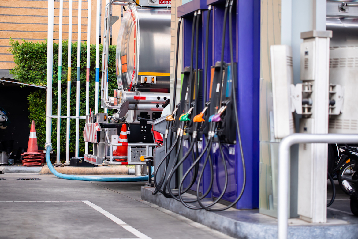 fuel tanker delivering inventory to retail gas station as part of supply chain logistics