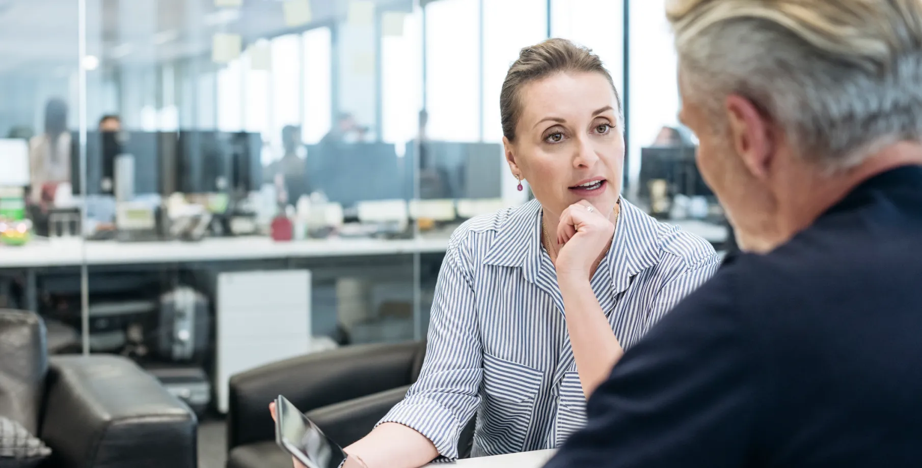 Woman and man working through business processes for customer success.